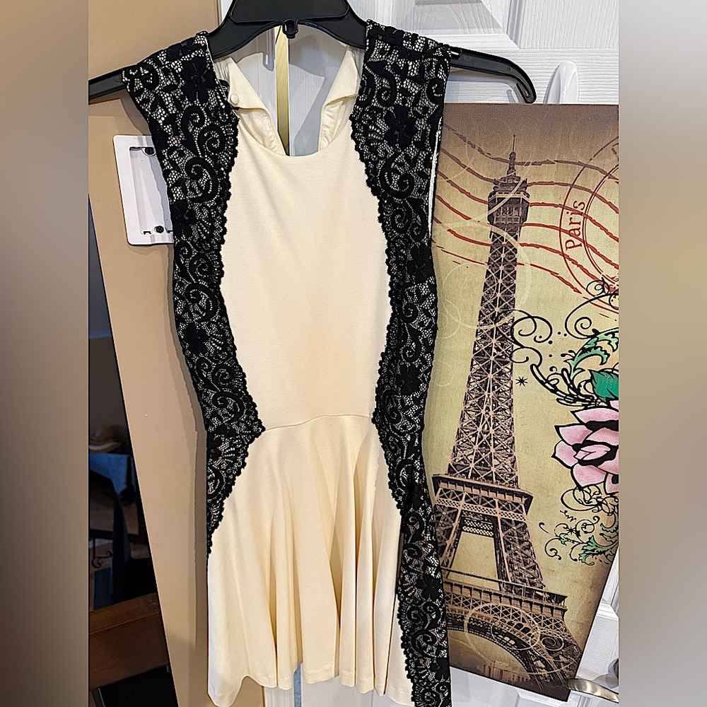 BEBE 
White and black lace dress